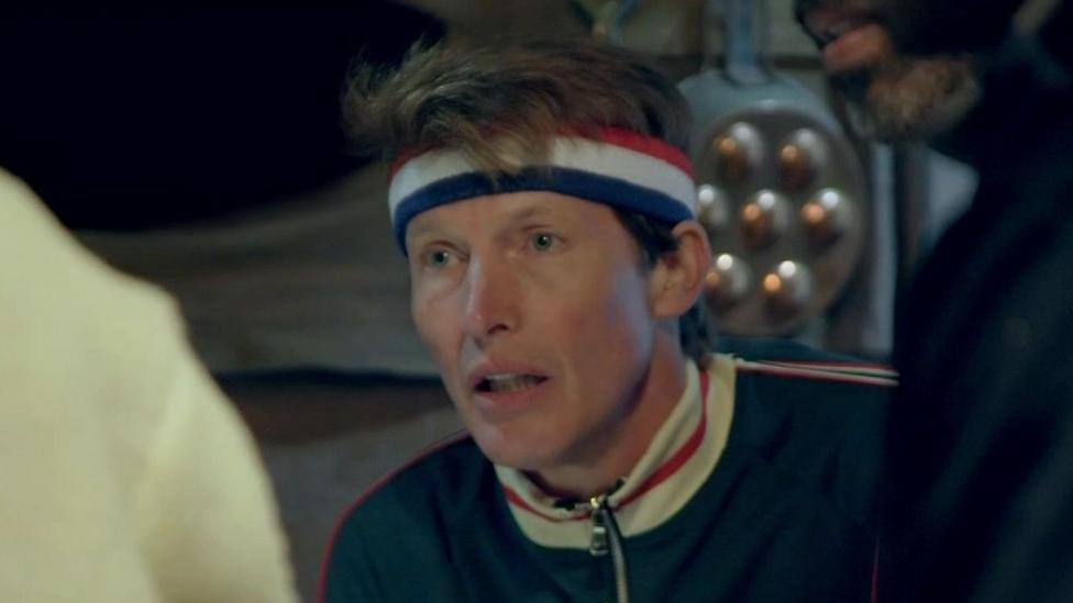 James Blunt wearing a sweatband