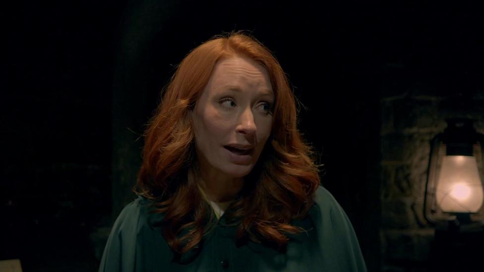 Traitor Hannah Fry wearing a green cloak