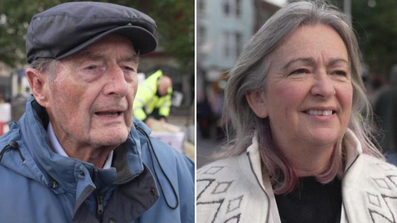 Ernest Dyson and MP Liz Saville Roberts stand in the centre of Caernarfon where protesters gathered for a rally