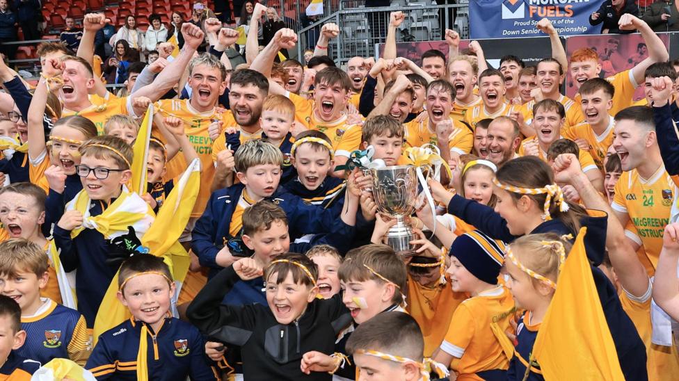 Clonduff celebrate the win with the fans
