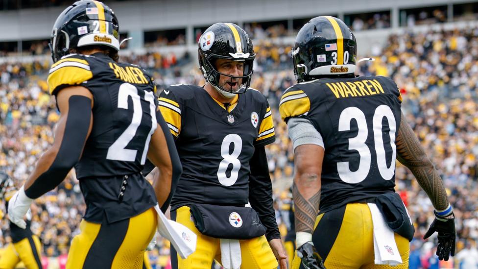Aaron Rodgers celebrates throwing a touchdown for the Pittsburgh Steelers
