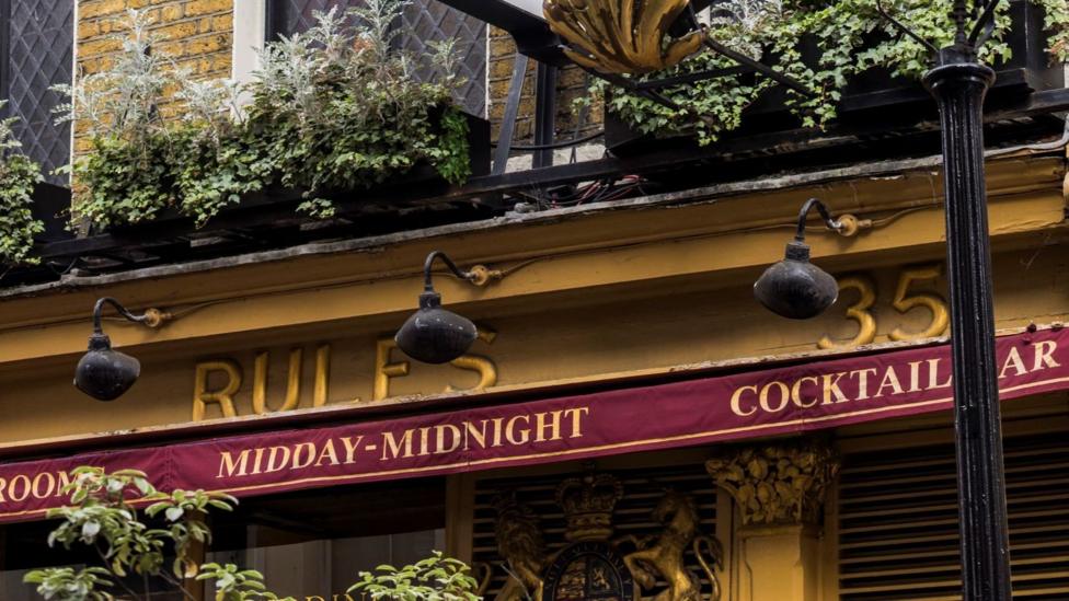 The exterior of Rules, with yellow and red signage 