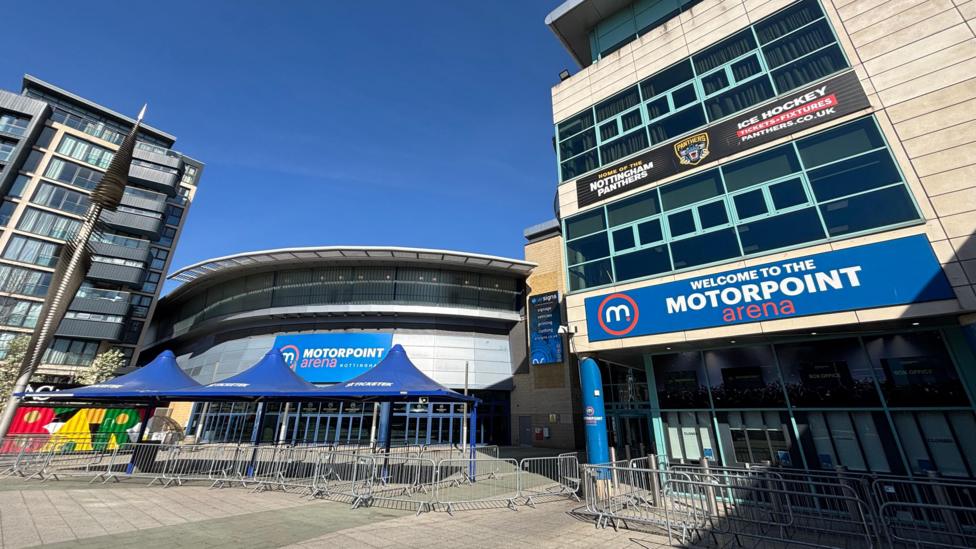 Large venue under a blue sky