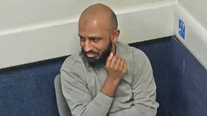 Photograph of Abusali Rahman. The image is taken from a film of him being questioned after his arrest by Greater Manchester Police.