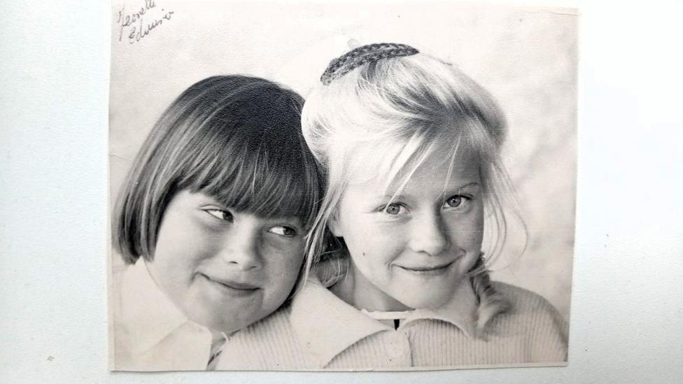 A black and white photograph showing Jeanette and Edwina as children