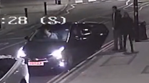 A CCTV still showing Michael Ashton and his partner getting into a black car parked by the side of the road.