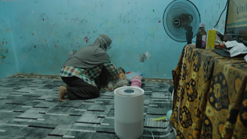 Dianyra Eka Nastiti with one of her children.