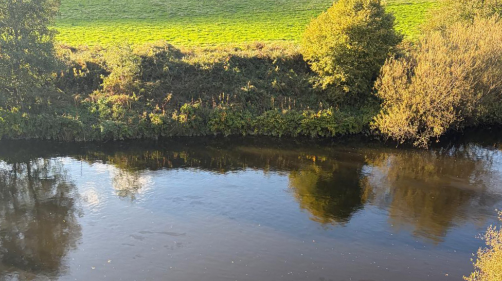 An image of the River Taff. The fuel leak is spreading from bank to bank