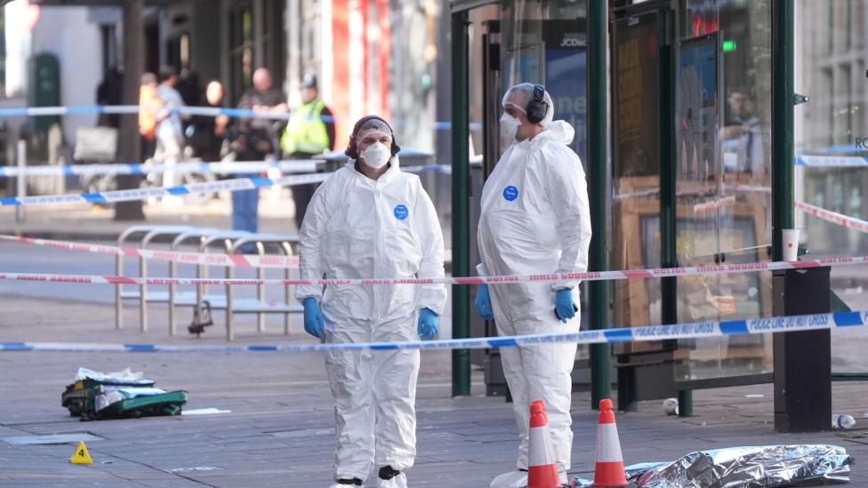 Forensic investigators at the scene on Angel Row in Nottingham, after a police officer has been shot in the city centre.