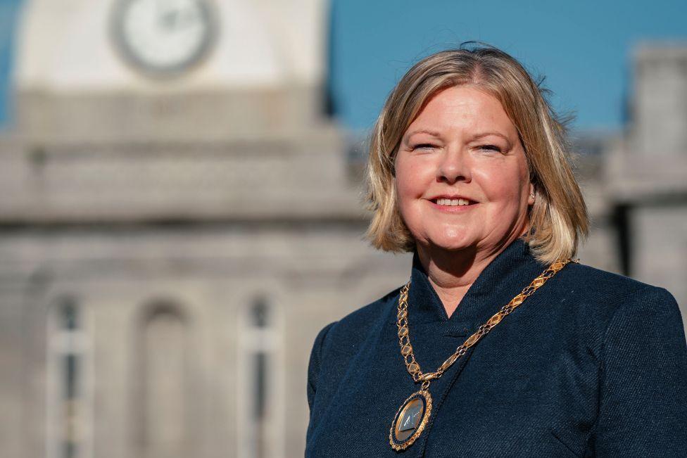 Provost of Aberdeenshire Judy Whyte smiling at the camera, she is wearing the chains of office around her neck.