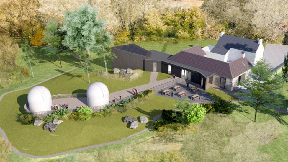 A computer-generated view of how the new Dark Sky Observatory might look with two domed buildings and a more traditional building beside it set in green countryside