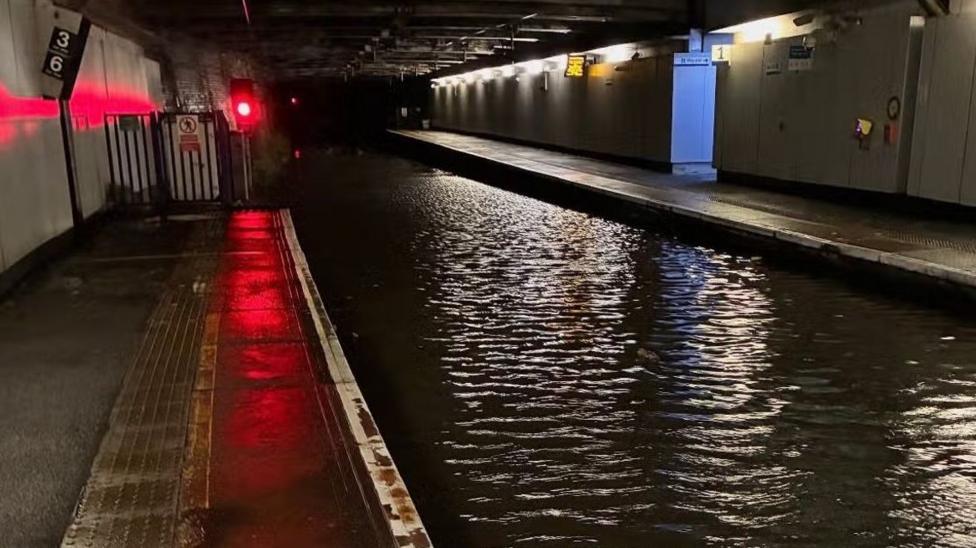 Flooded underground railway line at Dalmarnock