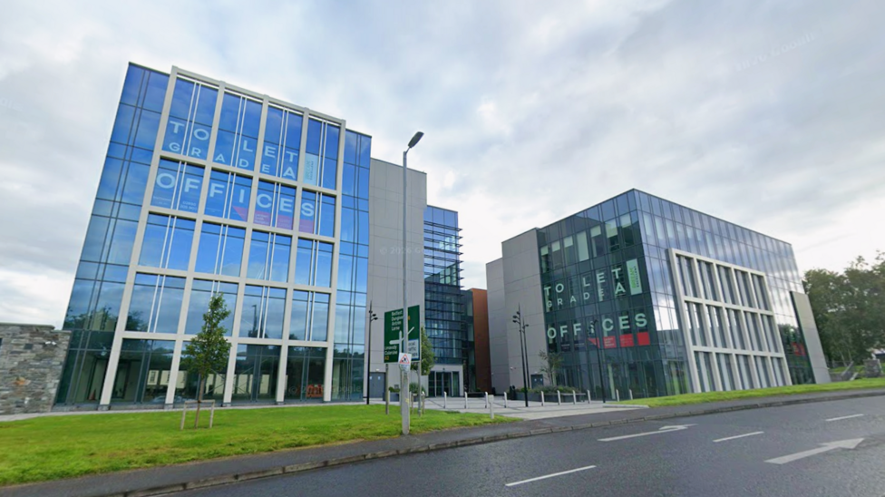 Ebrington Plaza is a large complex with a number of windows near the River Foyle. 