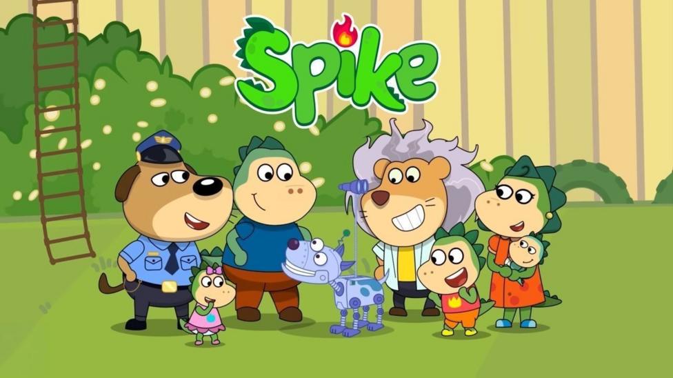 A group of seven cartoon animals and creatures, including green dragons, in colourful human clothes, gather in an animated garden, depicting green grass and fencing. They are all smiling.