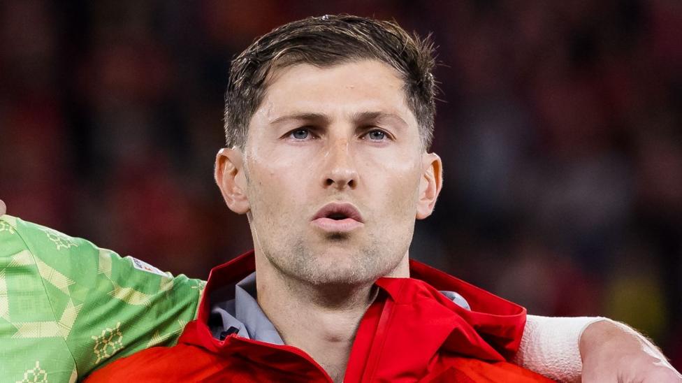 Ben Davies pictured singing the Welsh national anthem ahead of their defeat to Denmark in early October.