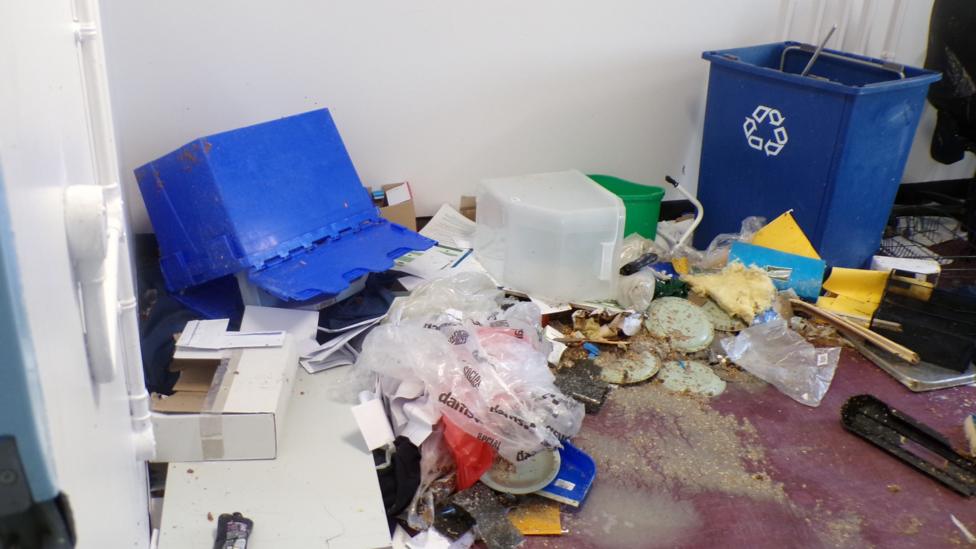 An image showing items strewn across the floor at HMP Polmont.