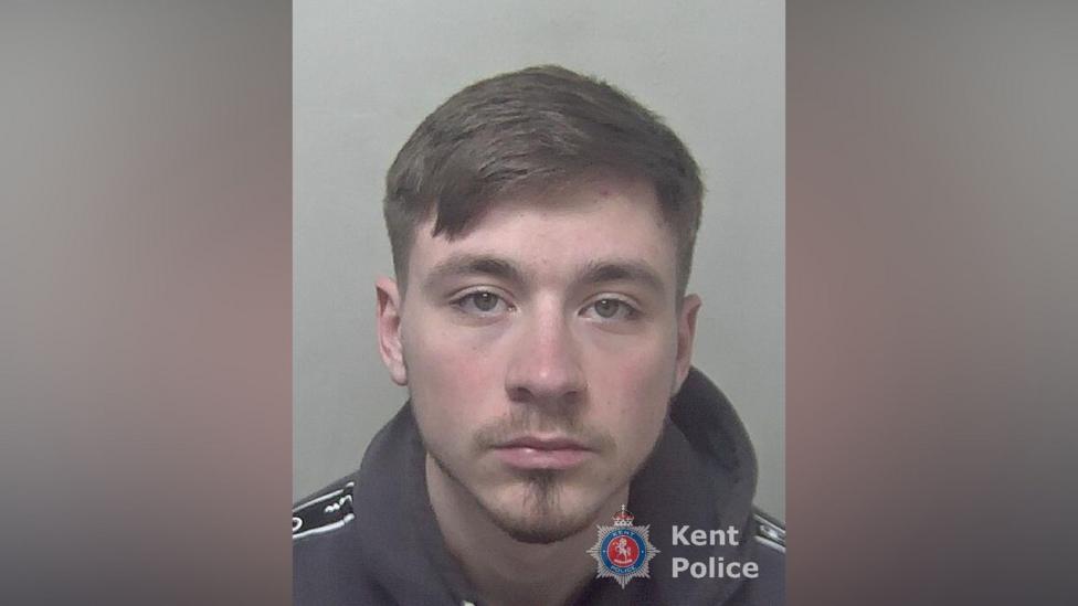 A police mugshot of 24-year-old man.