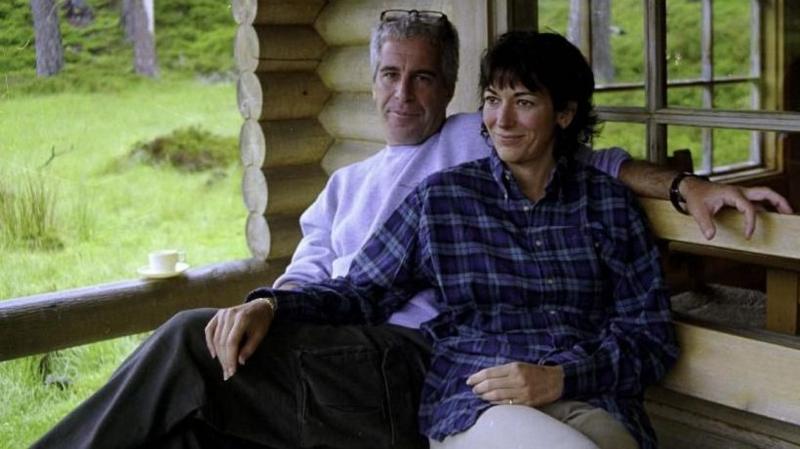 Epstein and Maxwell pictured sitting on a bench side by side at Balmoral in Scotland.