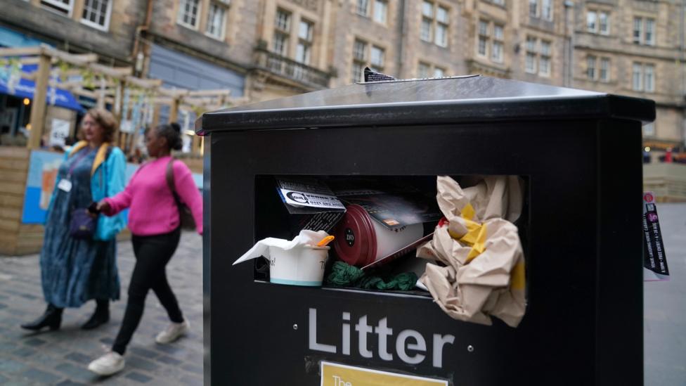 A full bin on Cockburn Street in Edinburgh.